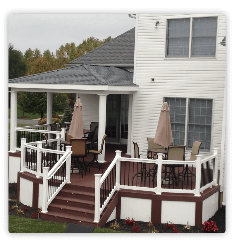 White house with red-brown deck and stairs