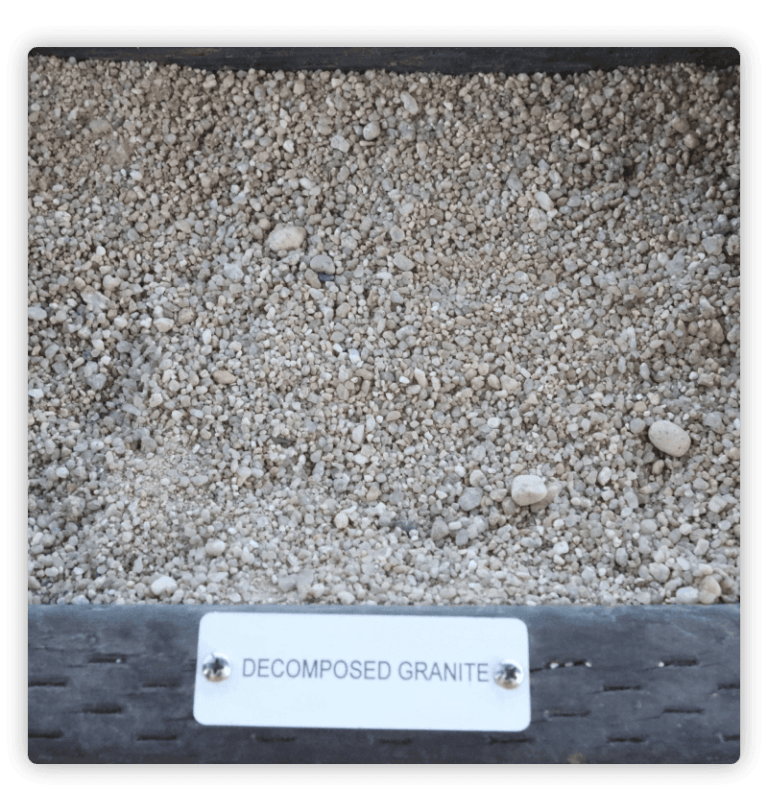 A box of fine to small pebbles labeled decomposing granite